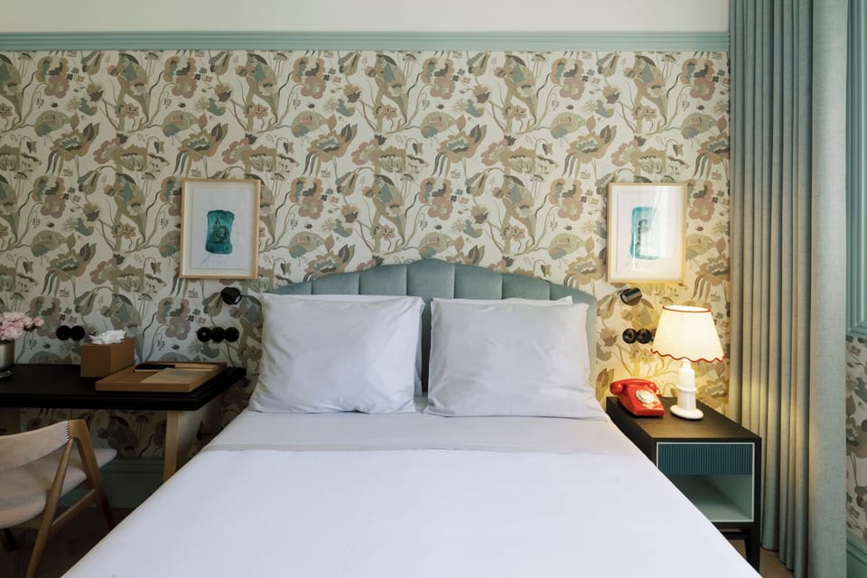 Sink into plush pillows in a cozy, boutique-style room.