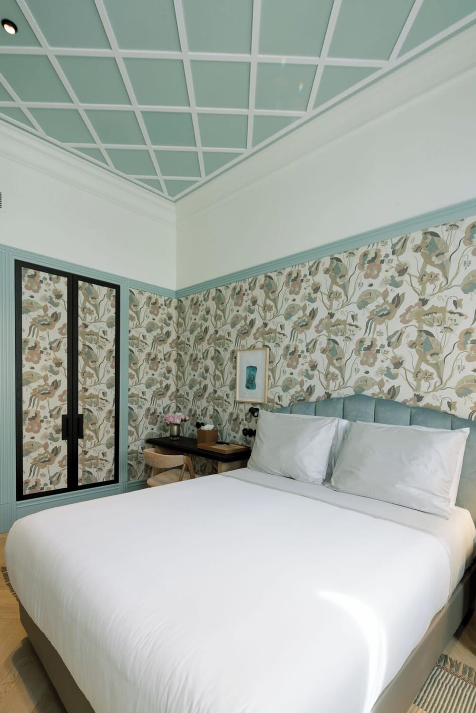 Breathe easy beneath high ceilings and soothing pastel tones.