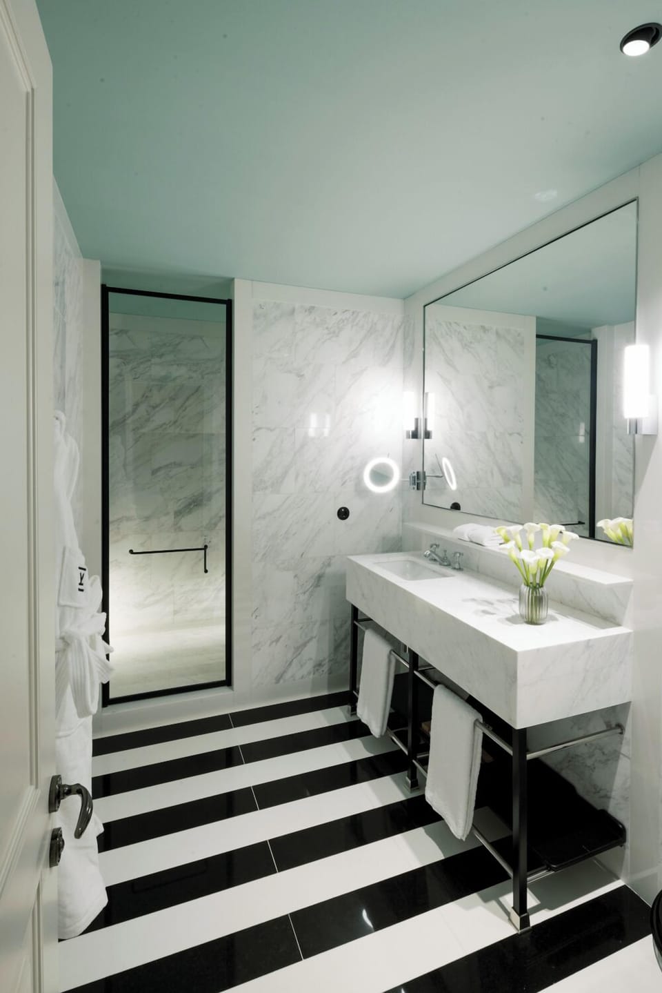 Step into a bold, spotless bathroom with a walk-in shower.