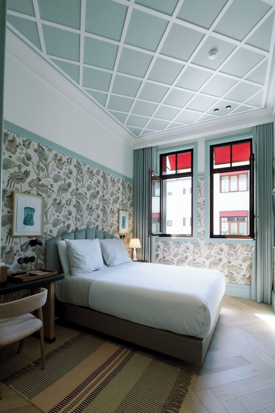 Unwind in a serene bedroom with soft light and charm.