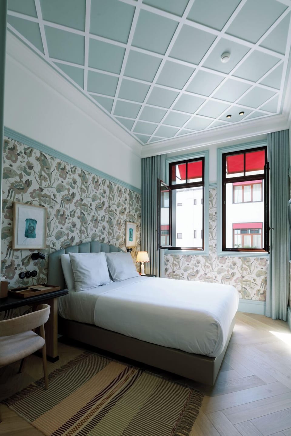 Unwind in a serene bedroom with soft light and charm.