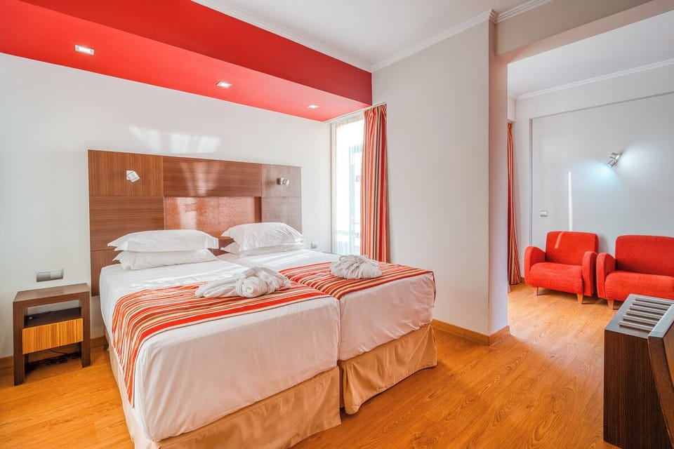 Unwind in a bright room with cozy seating corner.