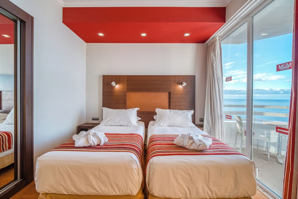 Wake up to sweeping ocean views from crisp twin beds.