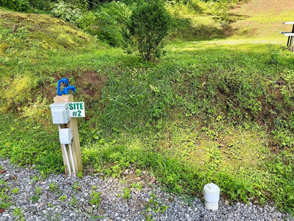 Site 2 — Full hookups and full charm, with a fire ring for perfect evenings