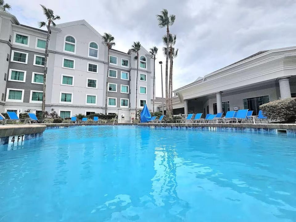 Pool area with lounge chairs for relaxing.