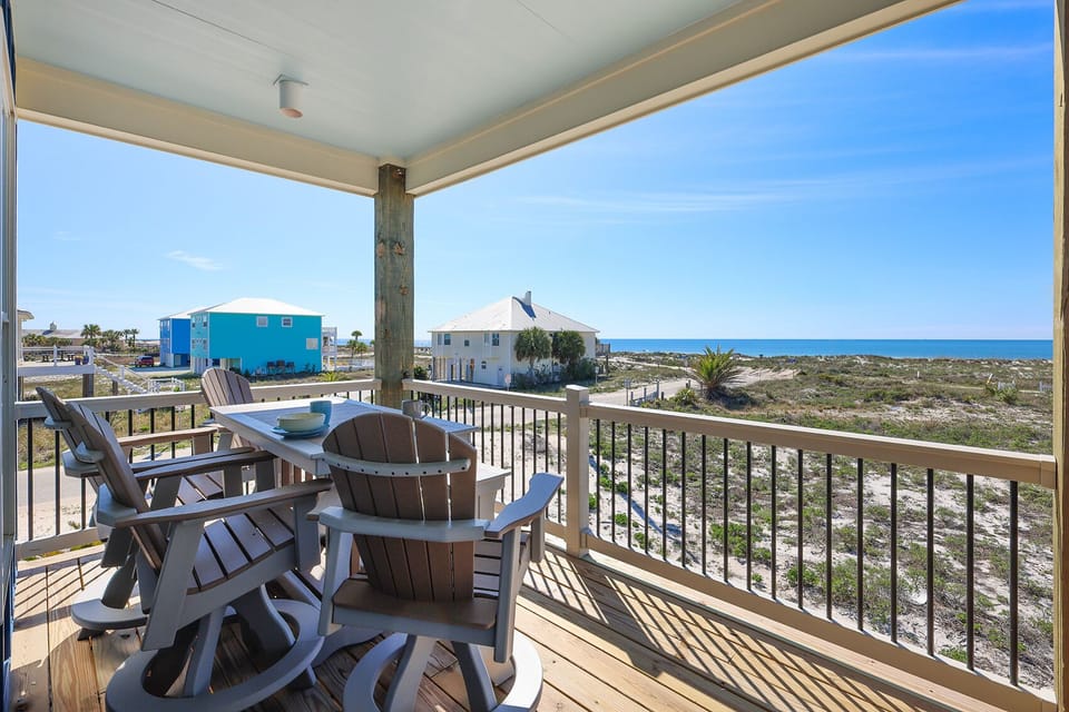 Enjoy a relaxing meal on the balcony of either of the Cole's Houses with a view of the serene coastline