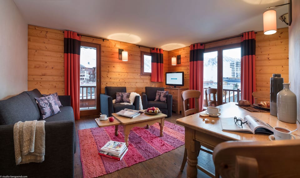 Bright living space with wood finishes and seating for the whole group to unwind.