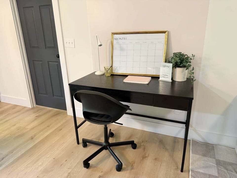 Workspace with calendar, drawer space, pens, task light, and ATT Fiber WiFi ️ 