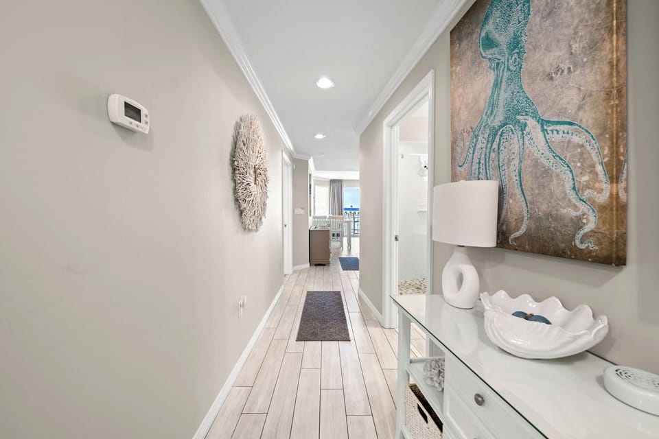 Welcoming entry hallway w/ soft light and coastal touches