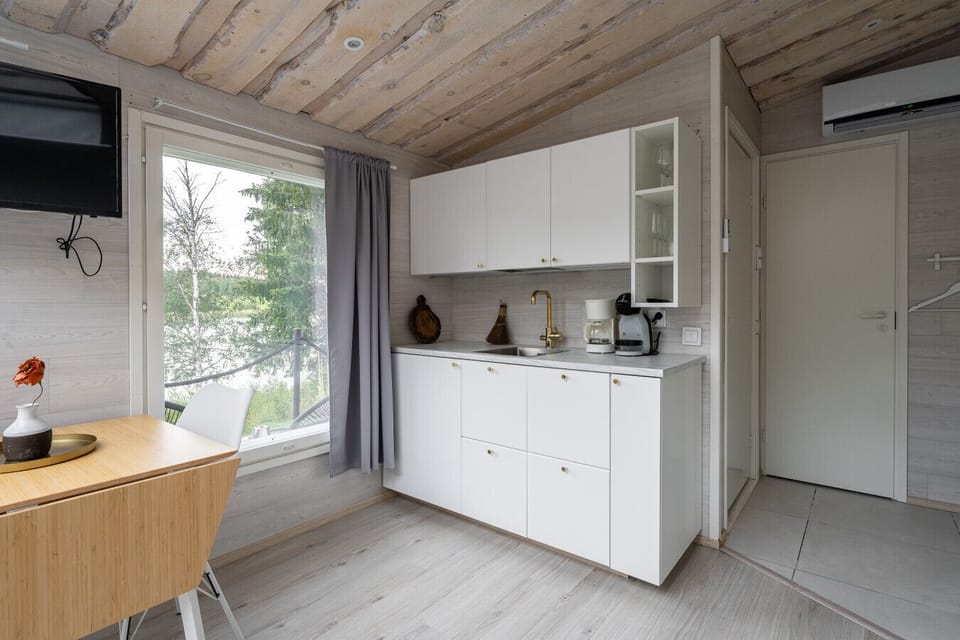 The compact kitchen is fully equipped with everything you need to prepare delicious meals during your getaway.