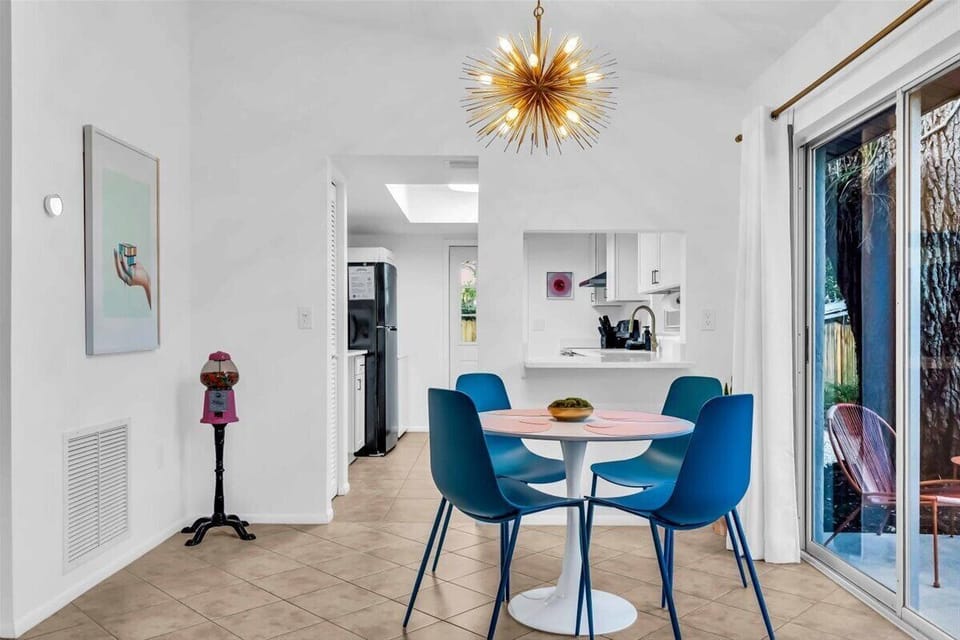 A dining room with a FUN-ky style and a retro gumball machine!