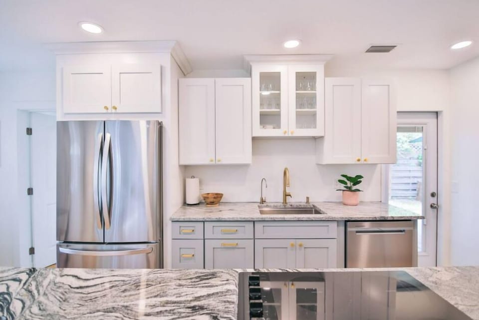 Appliances include a refrigerator, dishwasher, stove, and oven