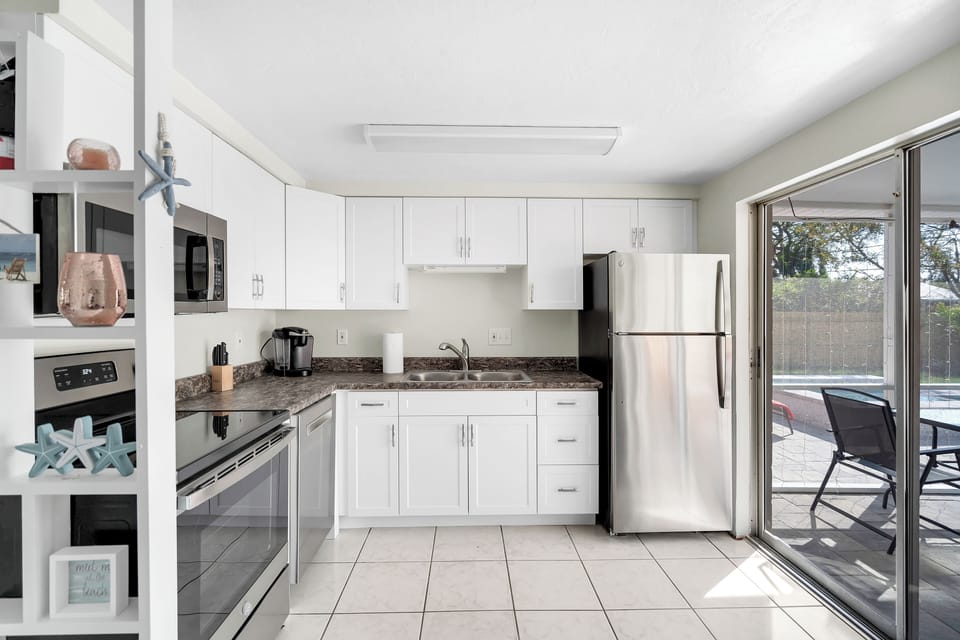 The lanai area is right off the kitchen providing great views of the pool!