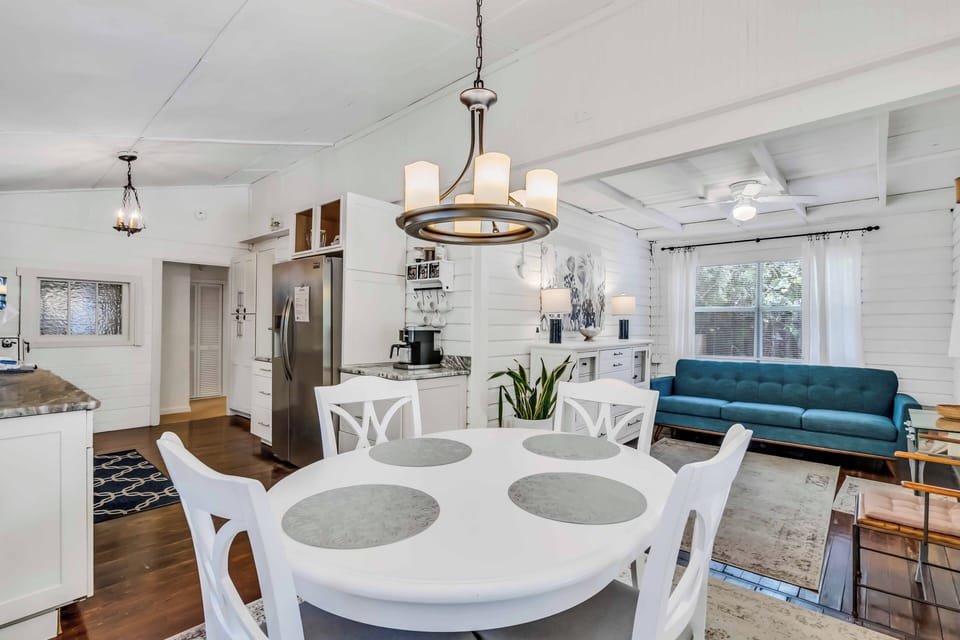 The dining room has a dining table that seats 4.