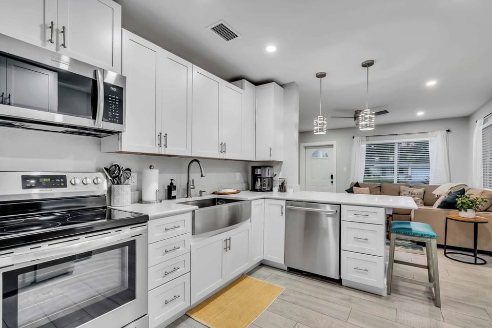 A full-size kitchen equipped with cooking utensils and modern appliances so you can enjoy your favorite meals even on vacation!