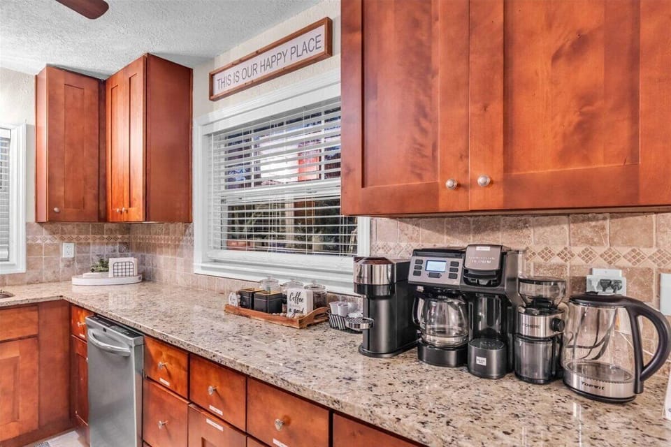 Dishwasher available for easy cleanup and a great view of the backyard patio and lake