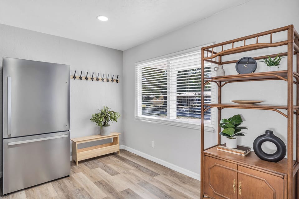 A full-size fridge and convenient wall-mounted hooks for your handbags or jackets.
