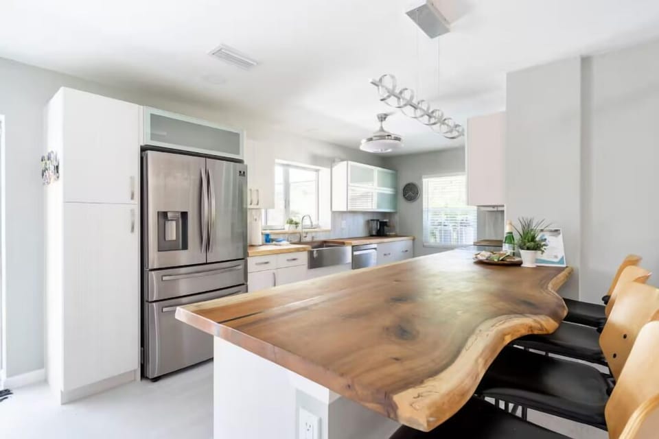 Full size kitchen with modern appliances and a beautiful wooden countertop