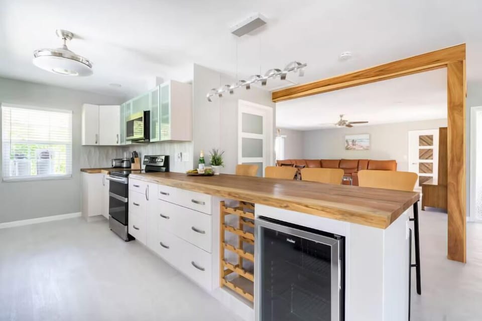 Kitchen and island layout with mini fridge to keep your drinks cold!