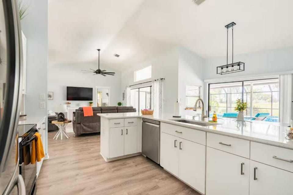 Open kitchen equipped with sink & dishwasher