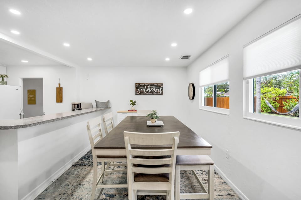 The dining table can comfortably seat 6 people. There are 4 chairs and bench seating on one side