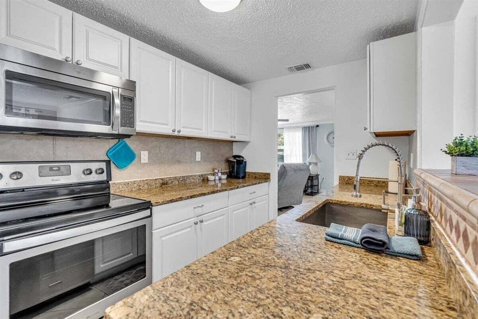 Plenty of countertop space to prep your meals along with modern appliances to cook them! Electric stove, oven, and microwave