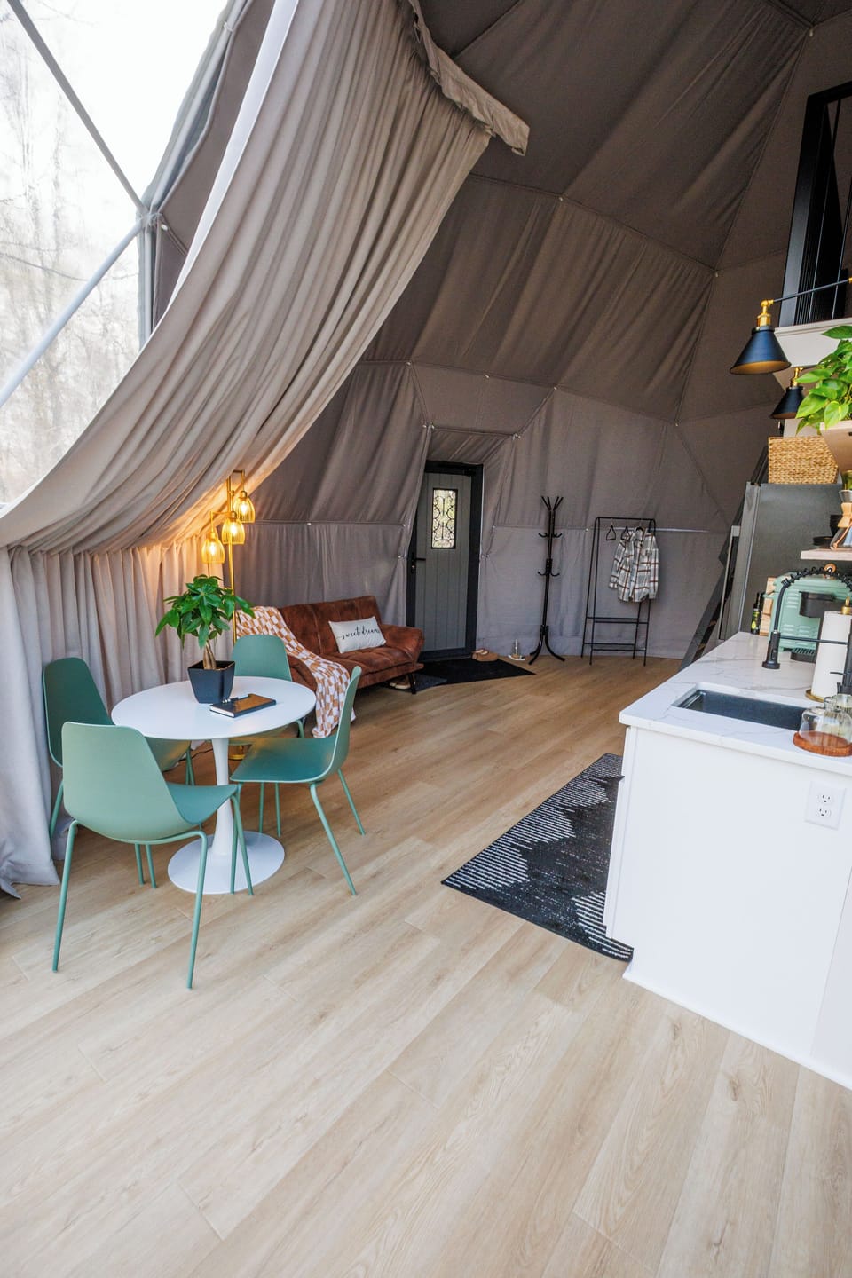 Living room, dining area, entrance, and kitchenette