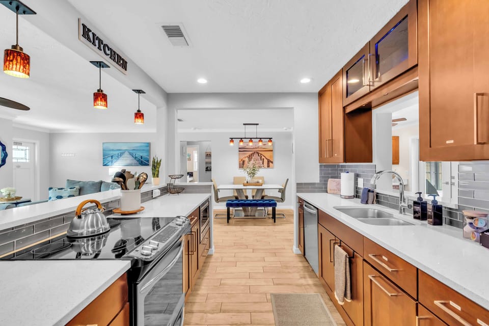 There are an electric stove, microwave, refrigerator, and dishwasher available.