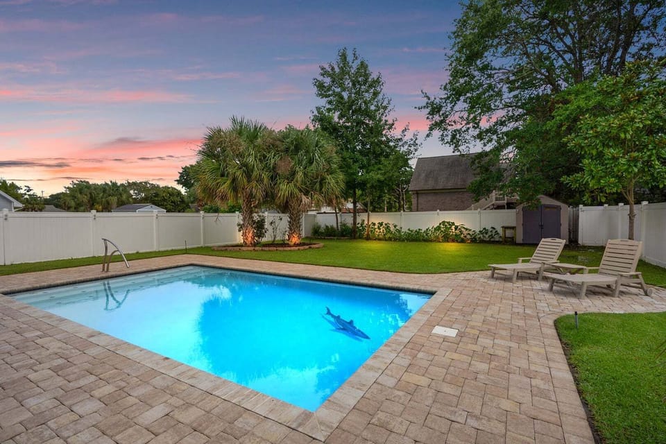 Private pool with lounge chairs and a shaded corner at Hillside Hideaway, a 4-bedroom Crescent Beach rental