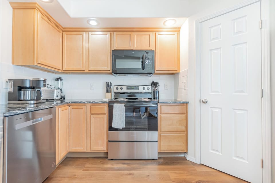 Electric stove & Microwave, fully stocked kitchen