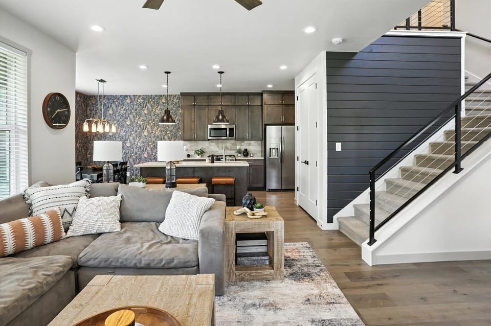 We've combined the best parts of a cozy living room, a gourmet kitchen, and a stunning staircase into one incredible space. 