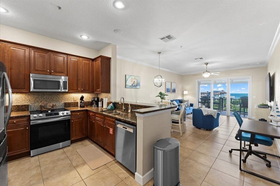 Spacious kitchen with modern appliances and plenty of counter space, making meal prep effortless whether you're cooking for two or hosting family dinners.