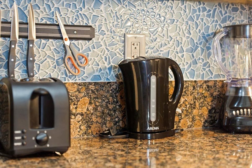 Toaster and electric kettle ready on the counter, making morning coffee and quick breakfasts simple and convenient.