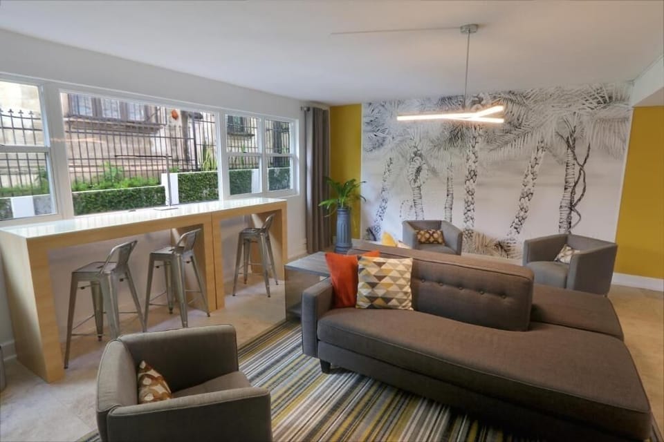 Gather with friends in the airy seating area for conversation.