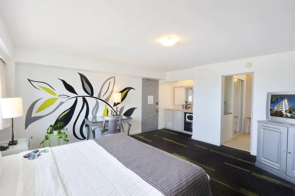 Spread out comfortably with workspace, TV, and open floor plan.