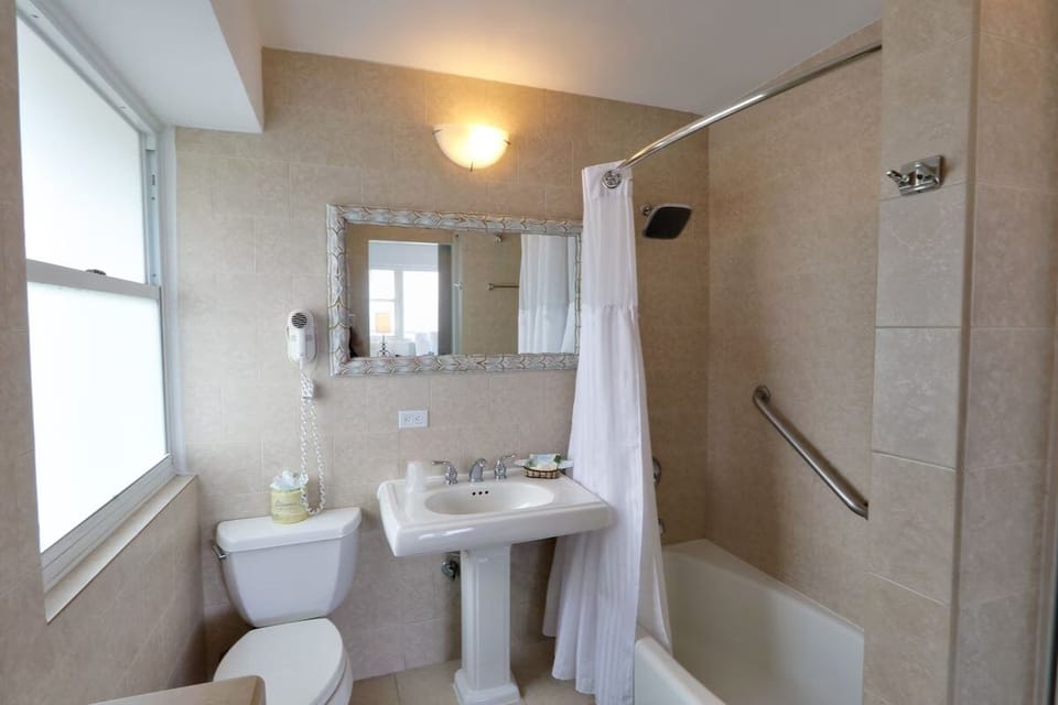 Refresh easily with a bright vanity and shower-tub combo.
