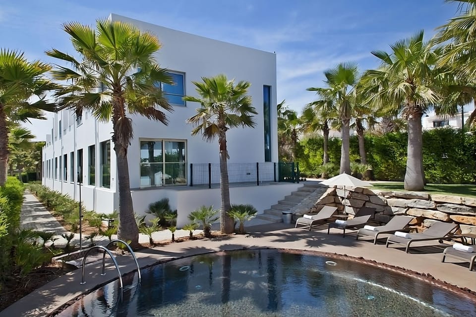 Enjoy sleek modern architecture steps from the refreshing pool.