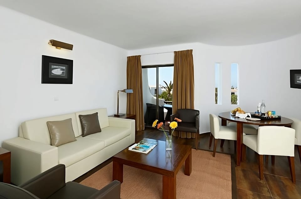Sip morning coffee beside the window in relaxed comfort.