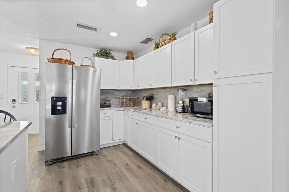 Cook and connect in the spacious, modern kitchen designed for every culinary adventure.
