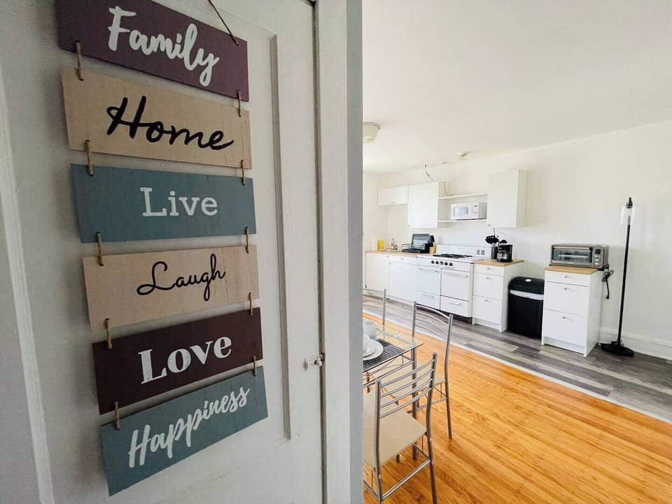 Step into a well-appointed kitchen designed for convenience. It includes a full-sized refrigerator, range, plenty of counter space for meal prep, and dining. You'll find generous storage in the cabinetry, making it easy to keep things organized.