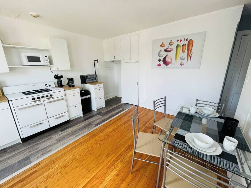 Step into a well-appointed kitchen designed for convenience. It includes a full-sized refrigerator, range, plenty of counter space for meal prep, and dining. You'll find generous storage in the cabinetry, making it easy to keep things organized.