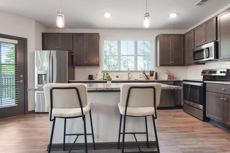 Embark onGather around our inviting dining table, where each meal transforms into a cherished moment. Immerse yourself in the warmth of shared experiences and delightful flavors. culinary adventures in our modern, fully equipped kitchen—the heart of
