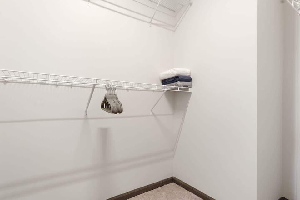 The large closet features an iron board & iron, extra towels, bed sheets, and toilet paper. You'll also find a vacuum for light messes and dryer sheets & laundry detergent for soft-feeling clothes every time!  Perfect for organizing your essentials.
