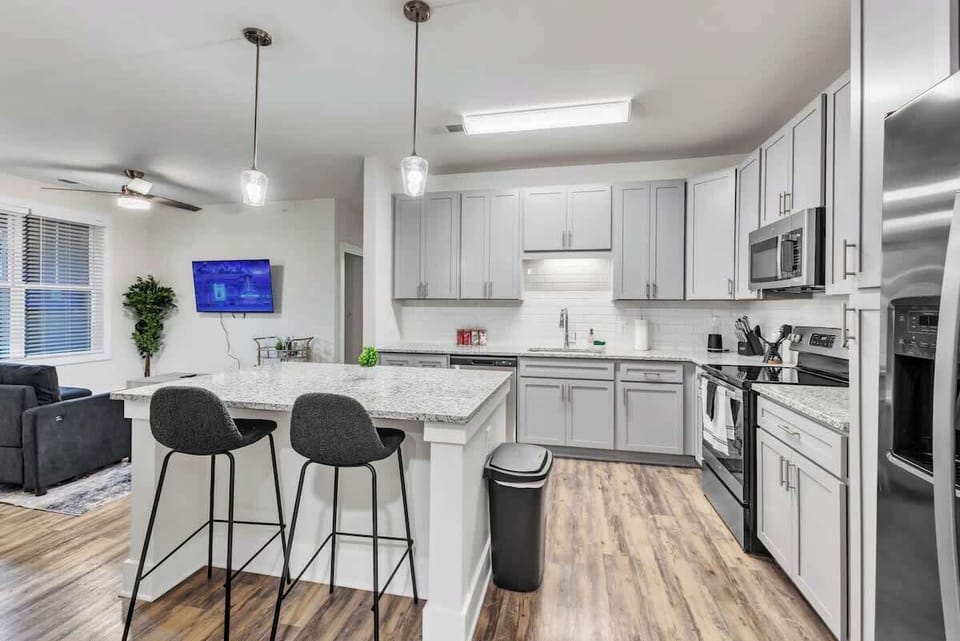 Cook Like a Pro – Experience the joy of cooking in this modern kitchen, where sleek countertops, state-of-the-art appliances, and plenty of storage make meal prep a breeze.
