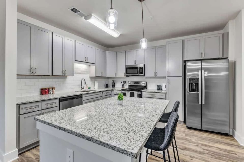 The Heart of the Home – Gather around the kitchen island and enjoy the vibrant energy of this space, perfect for preparing meals and making memories with family and friends.
