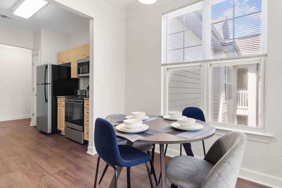 Share meals in a beautifully set dining area with seating for all and warm lighting.