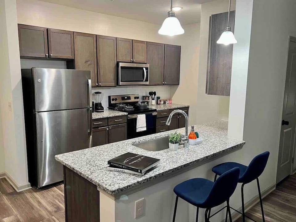 Experience the joy of cooking and family time in our cozy, fully-equipped kitchen. With stylish furnishings, modern appliances, and ample space, it's the heart of delightful moments and delicious meals.