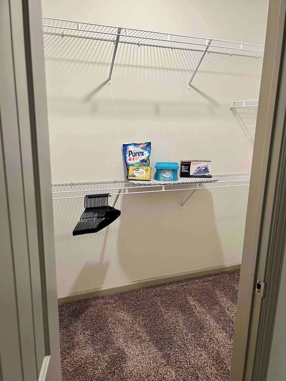 Discover convenience in our thoughtfully designed space with a storage shelf, complete with essentials and even an iron for your convenience. A touch of functionality for a seamless and enjoyable stay.