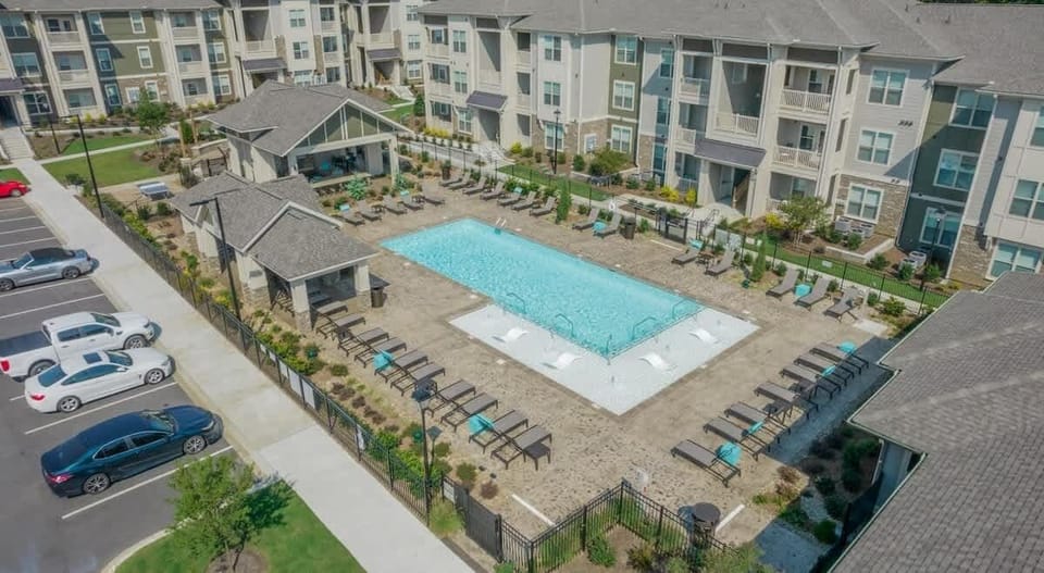 Dive into relaxation at our urban oasis. Discover a tranquil courtyard with a refreshing resort-style pool, perfect for unwinding after city adventures.