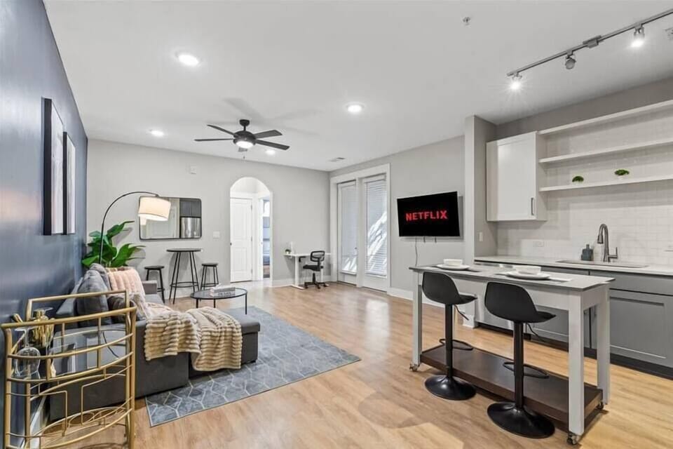 Enjoy evenings filled with laughter and conversation in this spacious living room, where every detail is crafted for the ultimate hosting experience.